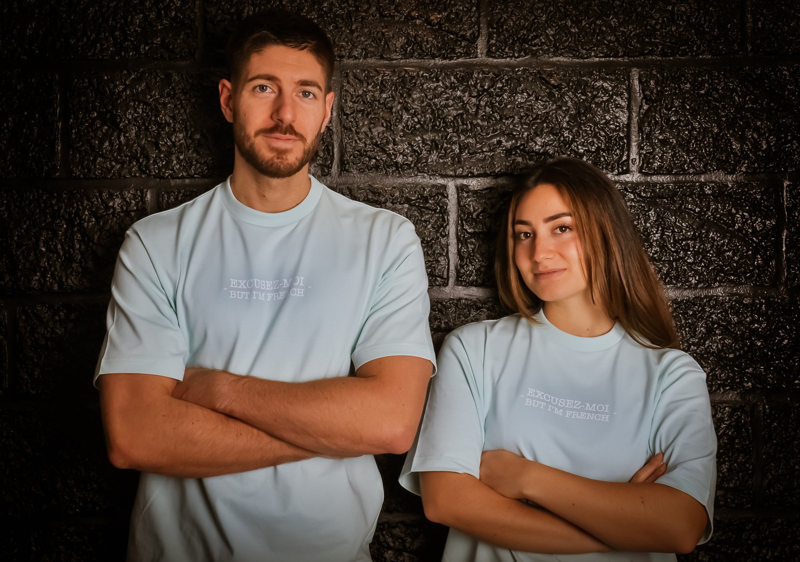 Man and girl wearing sky blue oversized Tees