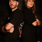 Man and girl wearing oversized black tee