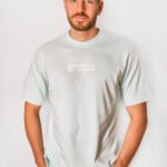 man wearing sky blue oversized tee