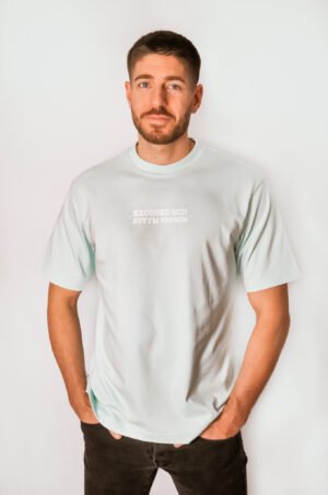 man wearing sky blue oversized tee