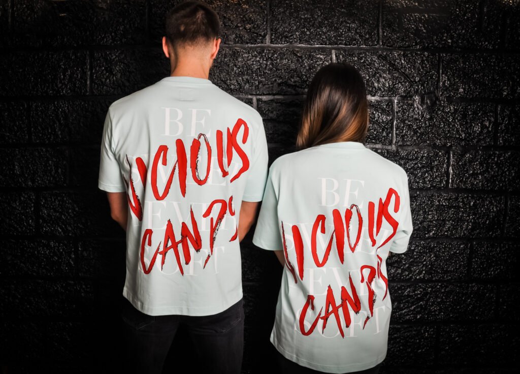 girl and man wearing Vicious Candy oversized tees