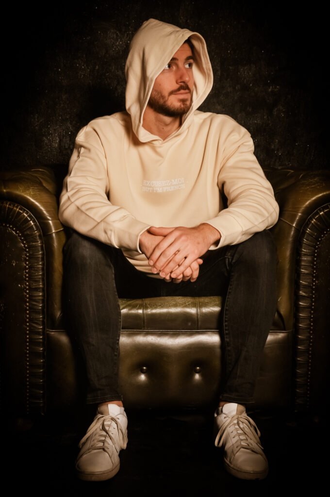 man wearing oversized beige hoodie